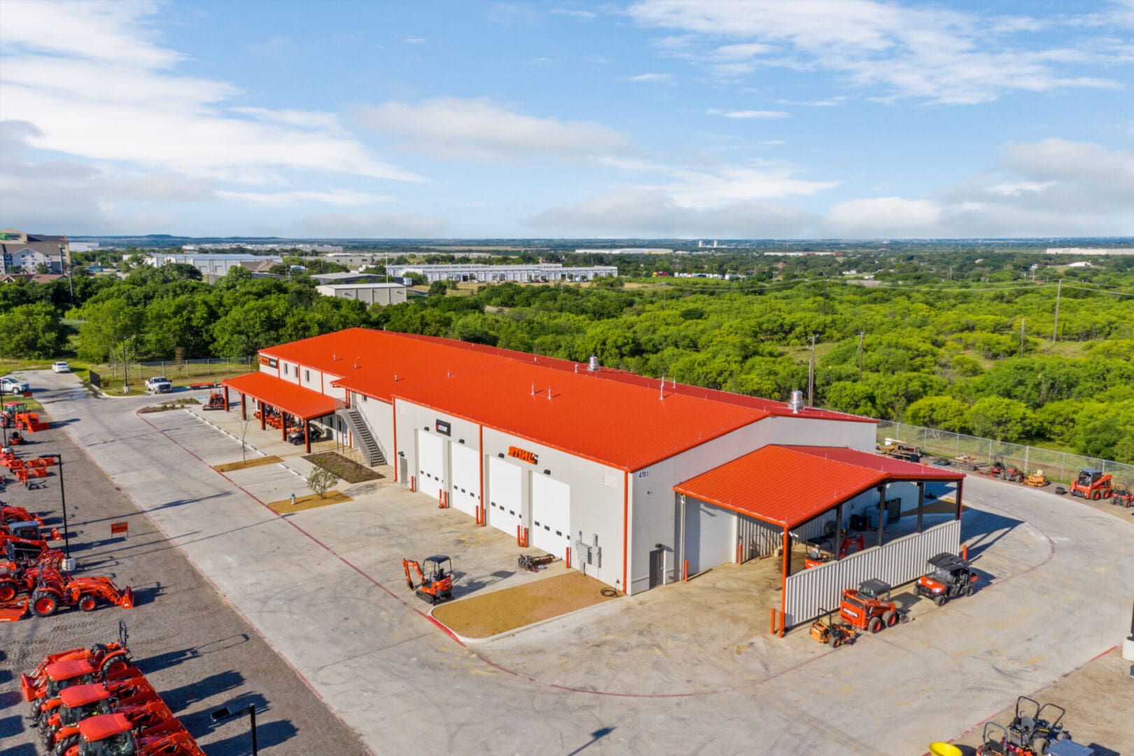 White Stihl warehouse with orange roofing