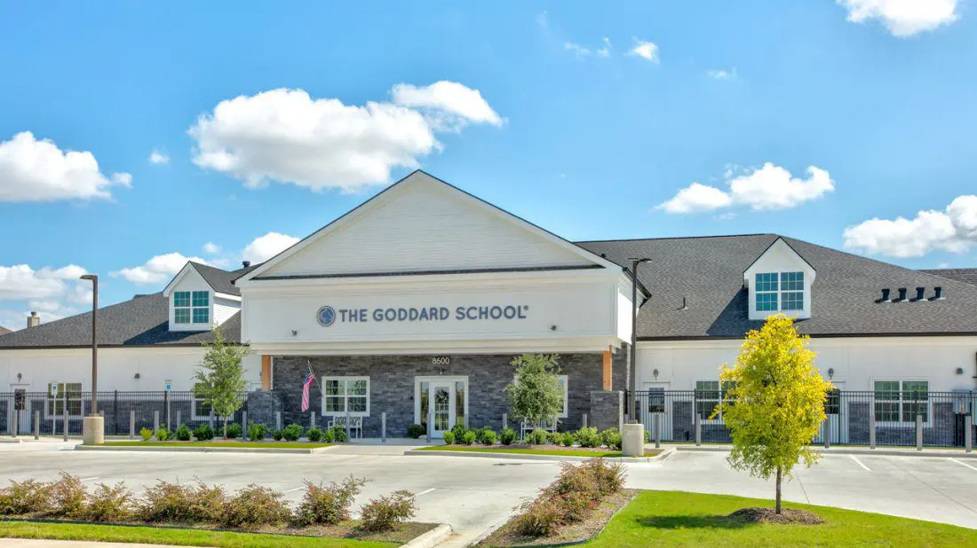 Gray and white academic building for the Goddard School