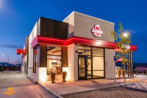 Fast-food restaurant exterior illuminated at dusk