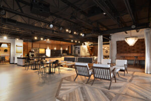 Modern open lounge with seating and chandelier